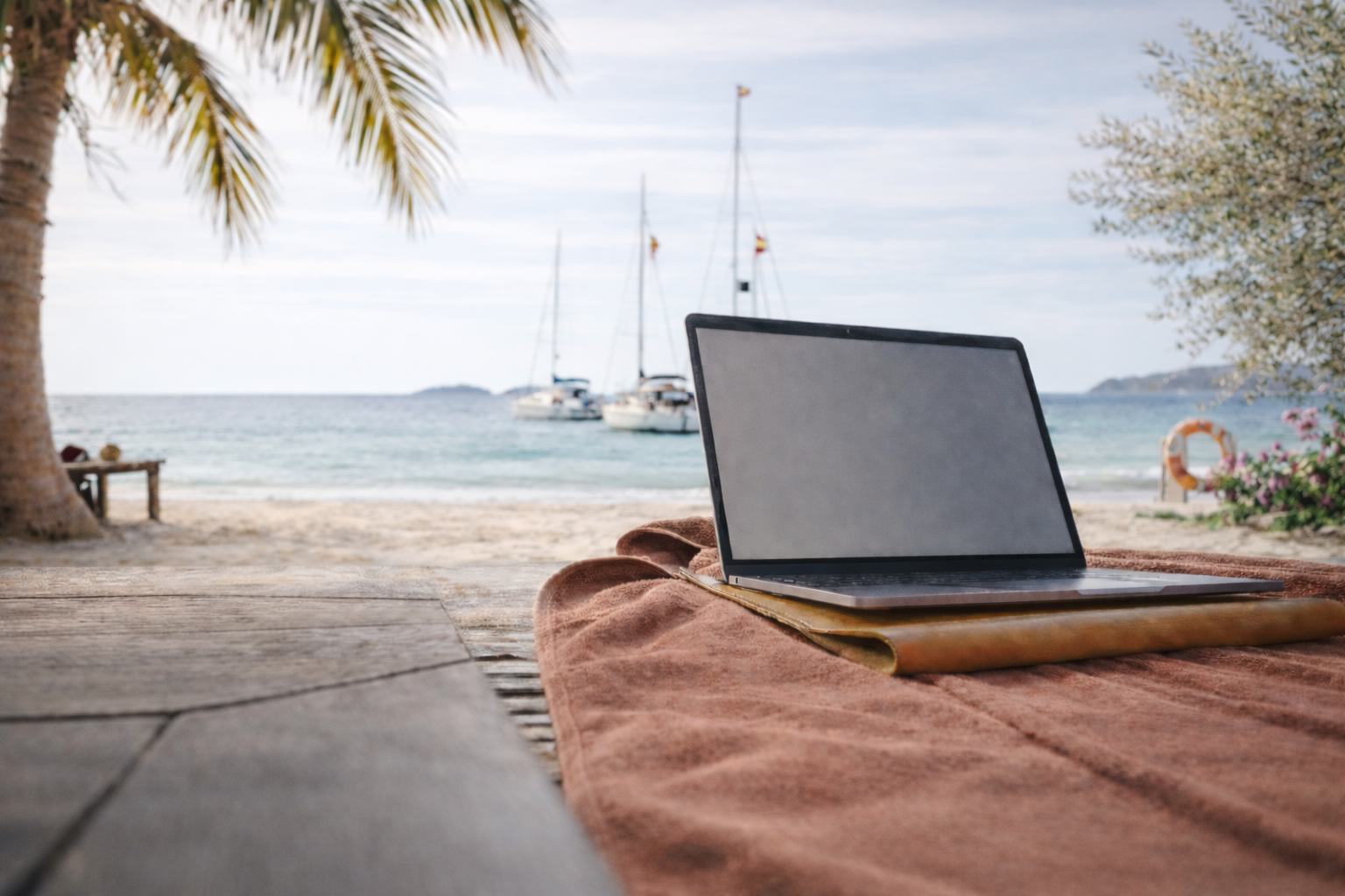 Laptop on beach - remote work lifestyle